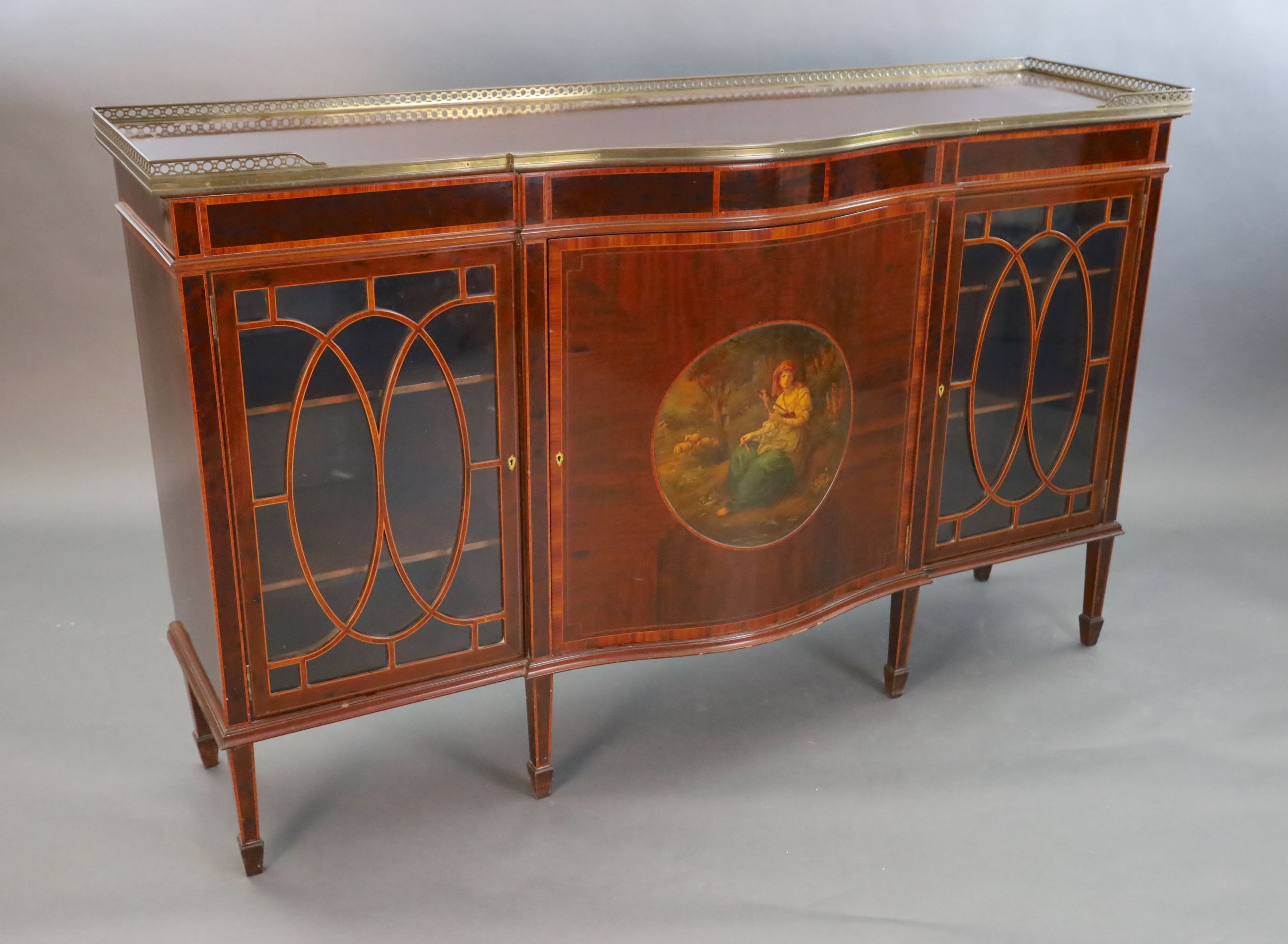 An Edwardian rosewood banded mahogany serpentine dwarf bookcase, W.5ft 1.5in. D.1ft 6in. H.3ft 3in.